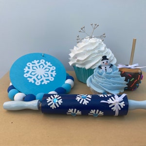 Winter Tiered Tray Set  with a wooden rolling pin, fake cupcakes, bead set, and  fake apple