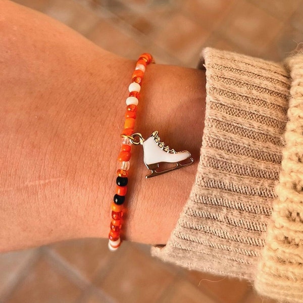 Bracelet/collier de perles de rocaille à breloque patin à glace