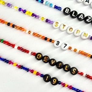 Equipo deportivo, F1 Fórmula 1, Nombre del jugador, Número del jugador, Pulsera del piloto imagen 7