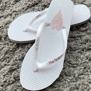 Personalised white flip flops for any occasions. Weddings, birthdays, bride,bridesmaids