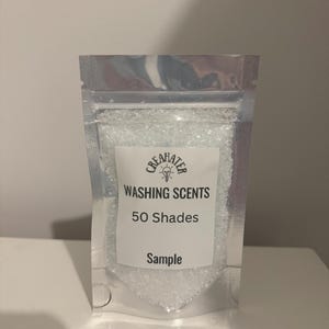 May include: A small silver pouch with a white label that says "CREAHATER WASHING SCENTS 50 Shades Sample". The pouch contains white crystals.