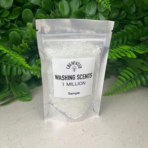 May include: A small clear plastic bag with a white label that says "Washing Scents 1 Million Sample" and contains white crystals.