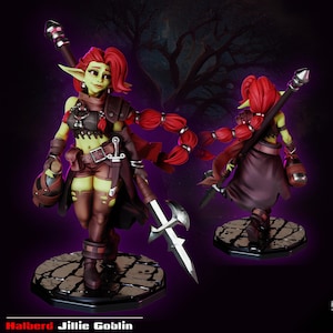 May include: A detailed figurine of a female goblin warrior with red hair and green skin. She wears brown armor, shorts, and boots, and carries a spear and a potion. The base is a stone-like pattern, and the text "Halberd Jillie Goblin" is at the bottom.