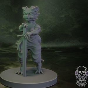 May include: A white ceramic mug with a black handle and the text "But First, Coffee" in a bold, black font. The mug is set against a blurred background, suggesting a cozy setting.