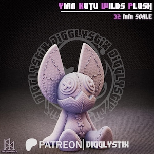 May include: A lavender-colored plush figure with large, stitched ears and button eyes. The text "YIAN KUTU WILDS PLUSH" and "32 MM SCALE" are displayed above the figure. The figure is a 3D-printed model with a stitched design.