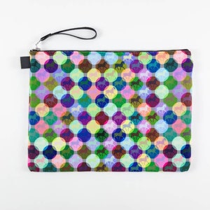 May include: A colorful clutch bag with a repeating pattern of horses inside circles. The circles are in shades of pink, green, blue, purple, and yellow.