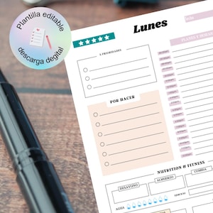 May include: A printable daily planner with a pink and white colour scheme. The planner includes sections for 3 priorities, a to-do list, nutrition and fitness, and notes. The planner is labelled "Lunes" which is Spanish for Monday.