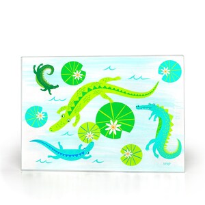 Playful Cute Swimming Gators Glass Cutting Board