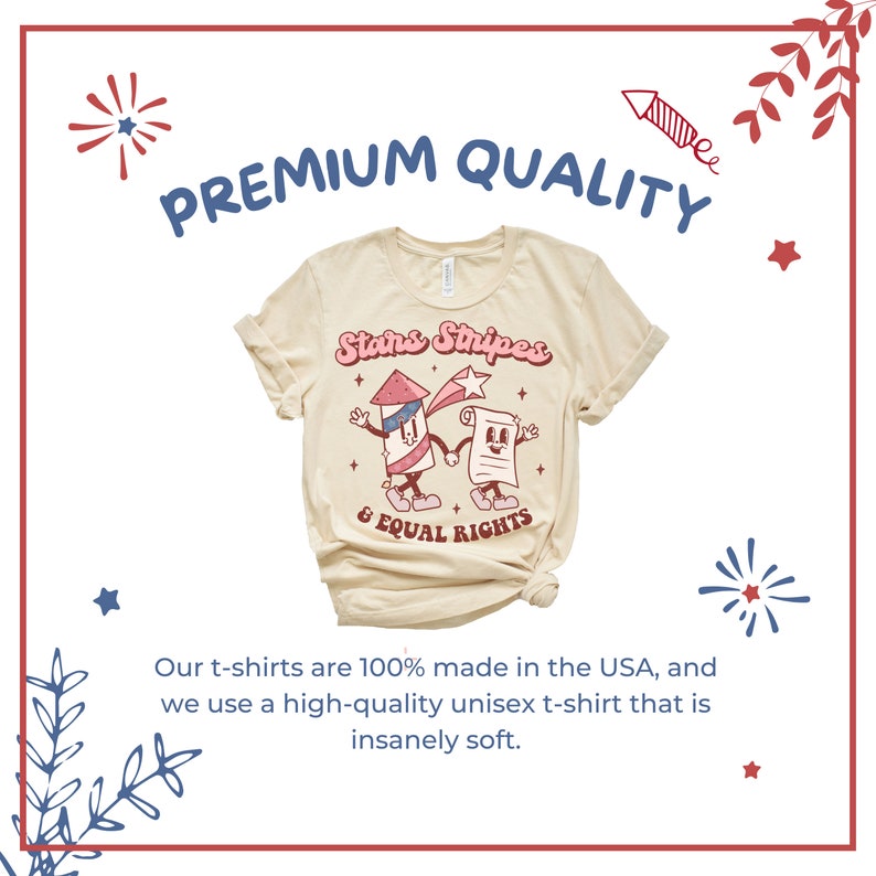 May include: Cream-colored t-shirt with rolled sleeves. The shirt features a graphic of a cartoon firework and a document holding hands, with the text "Stars Stripes & Equal Rights". The words "Premium Quality" are above the graphic.