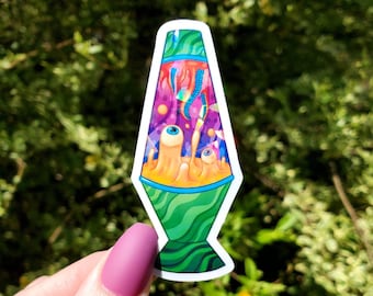 May include: A colorful sticker of a lava lamp with swirling green, purple, and orange liquid. The lamp has two eyes and a mouth, and is surrounded by colorful shapes and lines.