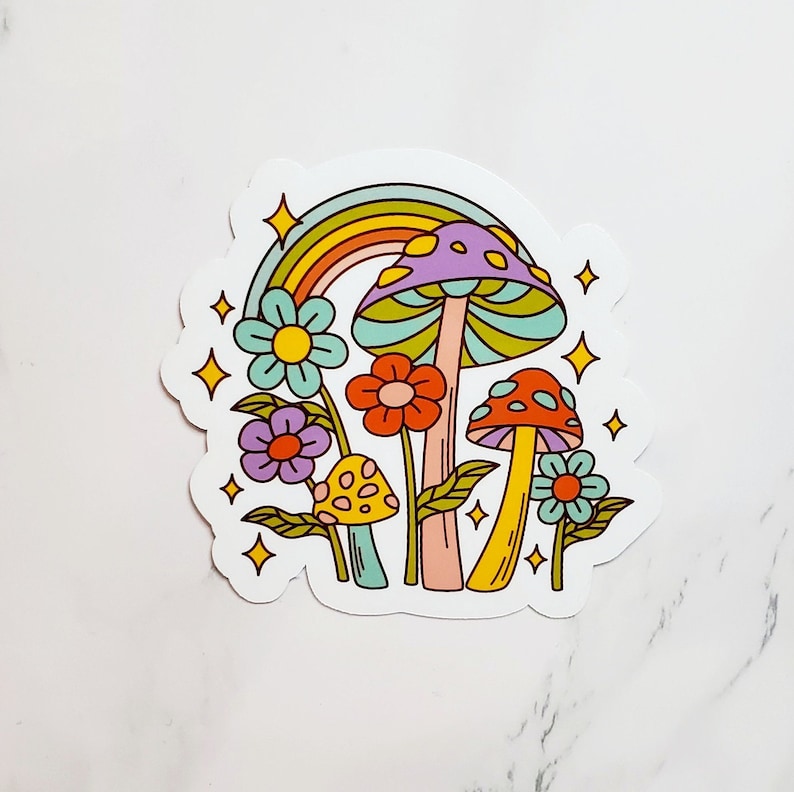 May include: A sticker featuring a rainbow, mushrooms, and flowers in a retro style. The mushrooms are purple, red, and yellow with white spots. The flowers are pink, yellow, and blue.