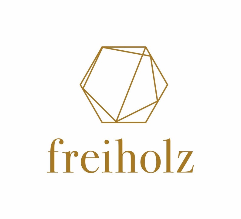 May include: A geometric logo with a gold outline of a hexagon with intersecting lines. The text "freiholz" is written below the logo in gold.