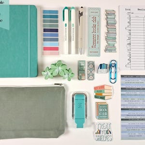 May include: An assortment of stationery items, including a teal journal, highlighters, a pen, bookmarks, stickers, and a pencil case. The image includes the text "Example of Basic Bundle".