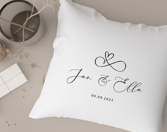 Personalized heart-shaped decorative pillow for couples, featuring first names and date, Valentine's Day, and wedding.