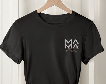 May include: Black t-shirt with a white graphic of two mountain peaks and the text "MA Mountain Adventures".
