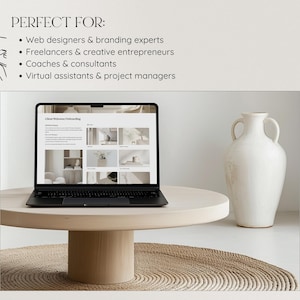 May include: A laptop computer with a white background showing a website with the text "Client Welcome & Onboarding". The laptop is on a light wood table with a white vase on the right side of the table.