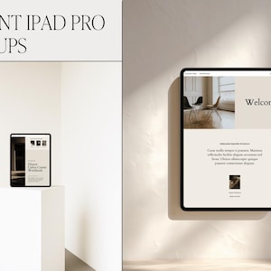 May include: Elegant iPad Pro mockups. The image shows two iPads, one on a white pedestal and another mounted on a wall. The screens display a website with the word "Welcome" and other text. The background is a neutral color.