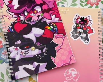May include: Two spiral-bound notebooks with colorful cartoon illustrations of anthropomorphic animals. One notebook features a large image, while the other has a smaller sticker version. The notebooks are pink and peach-colored, with the text "SHLIMAZ 2026" visible.