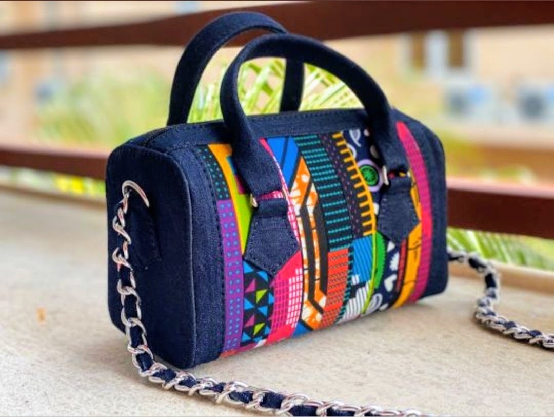 Petite pink bag with colorful patterned fabric designed by Mofa
