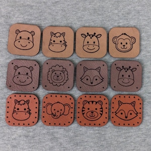 May include: Twelve brown leather patches with different animal faces, including a hippopotamus, zebra, giraffe, monkey, lion, fox, elephant, tiger, and raccoon. The patches are all square and have a dotted border.