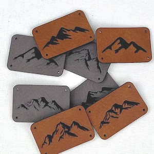 Toppe/ Motivi di montagna/ Finta pelle/ Fasce per capelli/ Etichette da cucire/ Pelle vegana/ Cucito/ Panorama di montagna/ Etichette per cappelli/ Materiali per cucire