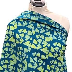 May include: Teal fabric with a pattern of light green abstract shapes.