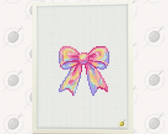 May include: A cross-stitch design of a colorful bow, featuring shades of pink, yellow, and blue. The bow is centered on a white perforated canvas, framed by a white border. The background is a light cream color with a repeating pattern of a needle and thread.
