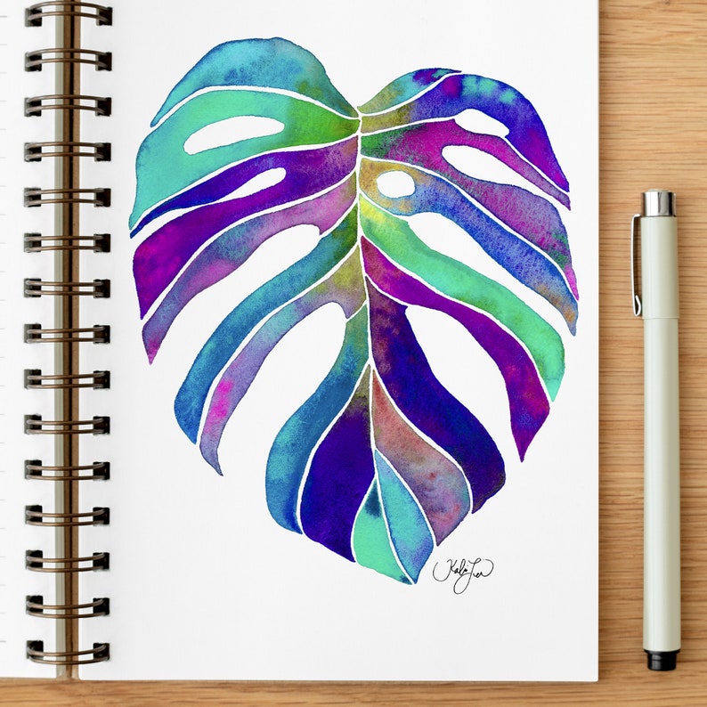May include: A watercolor painting of a large, colorful monstera leaf. The leaf is painted in shades of blue, green, purple, and pink. The leaf is outlined in black ink.