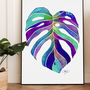 May include: Watercolor painting of a large, tropical monstera leaf in shades of blue, green, purple, and pink. The leaf is depicted in a realistic style with intricate details.