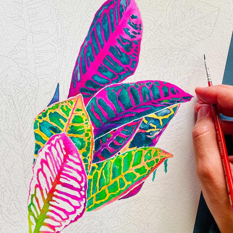 Puede incluir: Pintura acuarela de hojas rosas, verdes y azules sobre un fondo blanco.