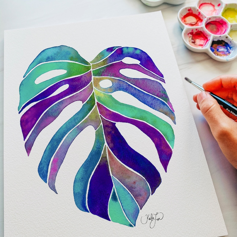 May include: Watercolor painting of a large, tropical monstera leaf in shades of purple, blue, and green. The leaf is painted on a white background.