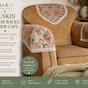 May include: A tan armchair with Ruskin chair backs and arm caps. The chair backs and arm caps feature a floral design with red and pink flowers and white lace trim. Text on the left reads "Ruskin Chair Backs & Arm Caps".