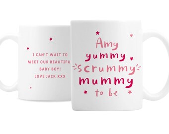 May include: White ceramic mug with pink text that reads "Amy yummy scrummy mummy to be" with stars. The other side of the mug has pink text that reads "I can't wait to meet our beautiful baby boy! Love Jack XXX" with stars.