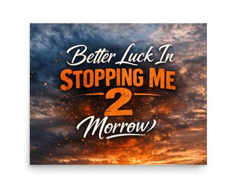 May include: A rectangular print with the text "Better Luck In Stopping Me 2 Morrow" in white and orange against a dramatic sky background with orange and blue hues. The print has a matte finish.