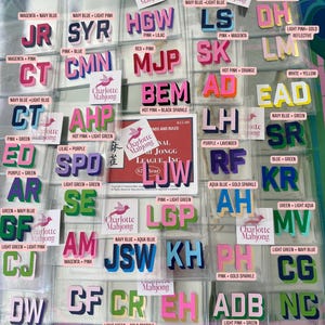 May include: A collection of individual Mahjong tile stickers featuring various two-letter and three-letter combinations in diverse color schemes. Each sticker is labeled with its specific color palette, such as pink, navy blue, and gold sparkle.