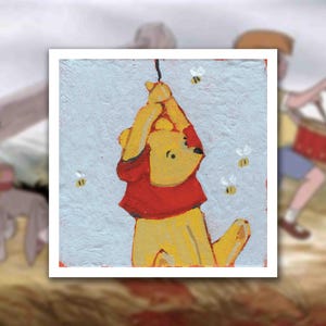 May include: A painting of Winnie the Pooh in a red shirt, hanging from a string, with bees buzzing around. The background is a light blue with a textured appearance. Other characters from the story are blurred in the background.