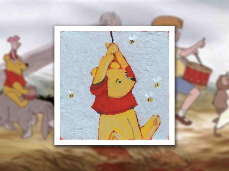 May include: A painting of Winnie the Pooh in a red shirt, hanging from a string, with bees buzzing around. The background is a light blue with a textured appearance. Other characters from the story are blurred in the background.