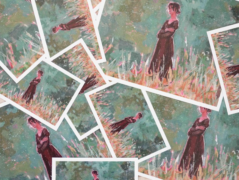 May include: A selection of art prints depicting a woman in a long brown dress in a field. The artwork has a painterly style with a green and orange colour palette. The prints are arranged in a scattered pattern.