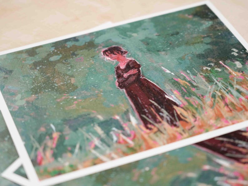 May include: Art print showing a watercolour painting of a person in a dark dress in a field of tall grass. The artwork has a soft, dreamy quality with greens, browns, and pinks. The print is on white paper.