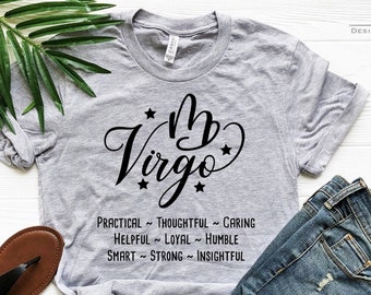 Puede incluir: Camiseta gris con un gráfico negro del signo del zodíaco Virgo y el texto "My Virgo" con estrellas. El texto debajo del signo dice "Practical ~ Thoughtful ~ Caring, Helpful ~ Loyal ~ Humble, Smart ~ Strong ~ Insightful".