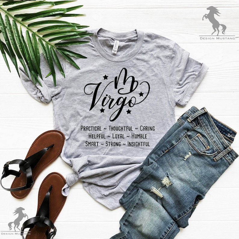 May include: Gray t-shirt with a black graphic of the Virgo zodiac sign and the text "My Virgo" with stars. The text below the sign reads "Practical ~ Thoughtful ~ Caring, Helpful ~ Loyal ~ Humble, Smart ~ Strong ~ Insightful".