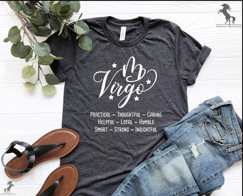 May include: A gray t-shirt with a white graphic of the astrological sign Virgo and the text "★ Virgo ★ PRACTICAL ~ THOUGHTFUL ~ CARING HELPFUL ~ LOYAL ~ HUMBLE SMART ~ STRONG ~ INSIGHTFUL"