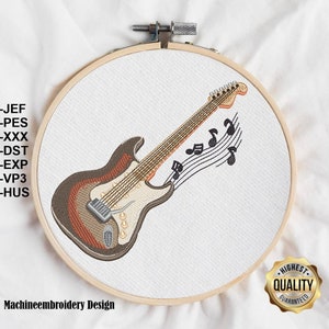 May include: Machine embroidery design of a brown and orange electric guitar with musical notes. The design is in a hoop and the text "Machineembroidery Design" is below the hoop. A gold seal with the text "Highest Quality Guaranteed" is in the lower right corner.