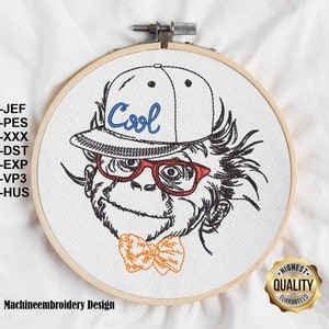 May include: Machine embroidery design of a monkey wearing a white baseball cap with the word "Cool" in blue lettering, red glasses, and a yellow bow tie.
