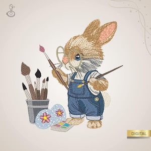 May include: An embroidered design of a bunny wearing glasses and denim overalls, holding paintbrushes. A bucket of paintbrushes and painted Easter eggs are also in the image. The word "DIGITAL" is in a gold rectangle.
