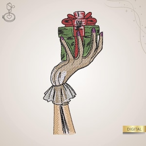 Könnte beinhalten: Gesticktes Design einer Hand, die eine grüne Geschenkbox mit einer roten Schleife hält. Die Hand hat lila Fingernägel und trägt einen weißen Rüschenärmel. Das Wort "DIGITAL" steht in einer goldenen Box.