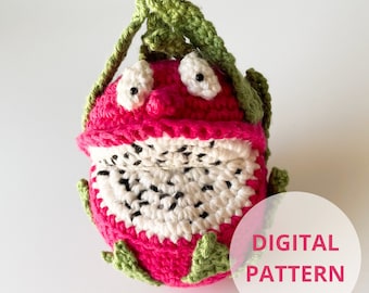 May include: A crocheted dragon fruit plush toy with green leaves and black eyes. The toy is pink and white with a textured surface. DIGITAL PATTERN.