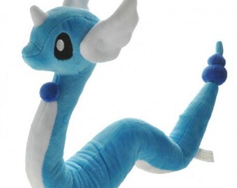 dragonite holding dratini plush