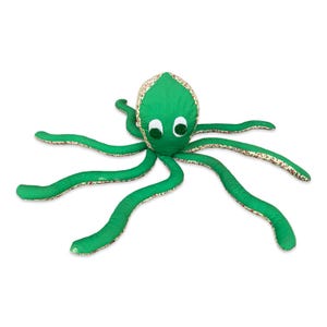 May include: A green stuffed octopus with white eyes and a patterned head. The octopus has eight long, curved tentacles. The tentacles are green with a floral pattern on the edges. The octopus is made of soft fabric.