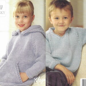 May include: Two children wearing knitted jumpers. The girl is wearing a lavender hooded jumper with a pocket. The boy is wearing a light blue jumper with a v-neck.